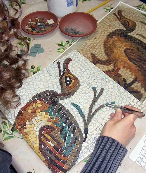 Girl making a mosaic
