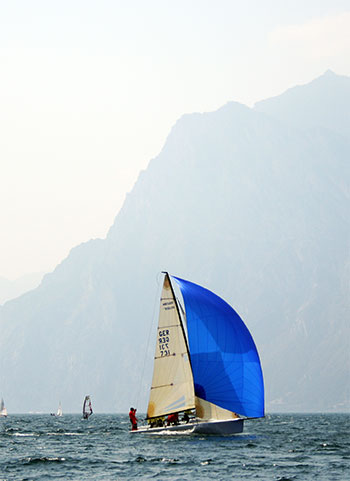 Sail boat sailing on lake Garda