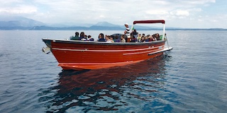 red boat on lake Garda