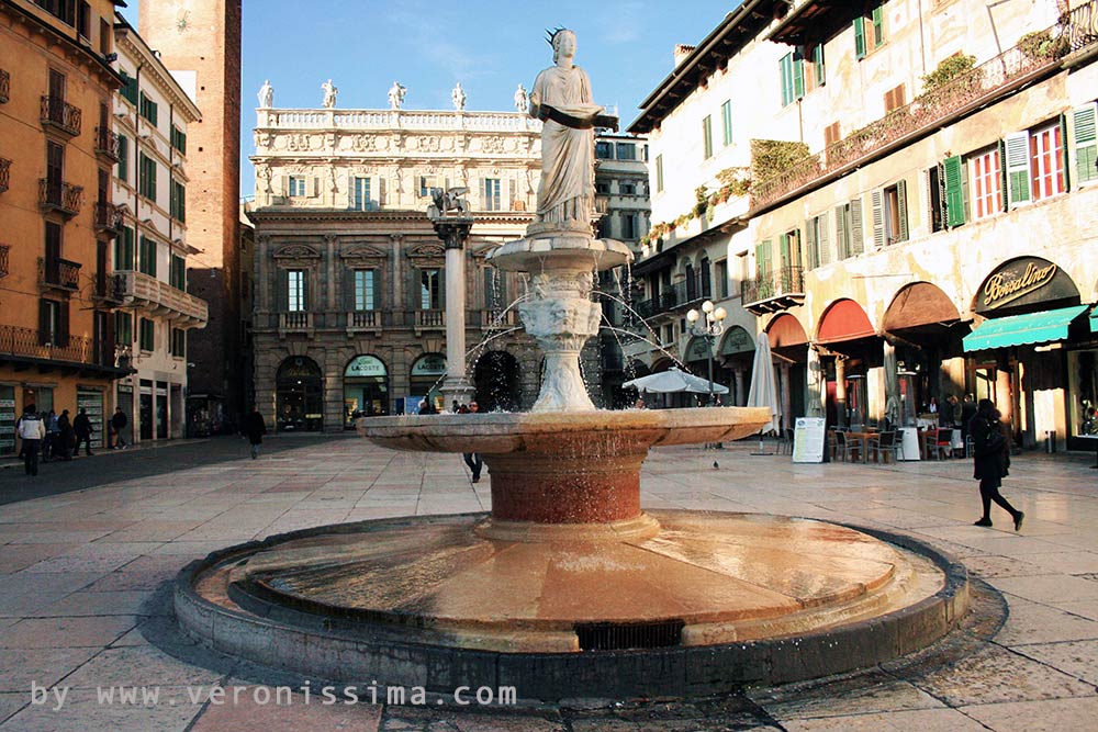 the fountain of Madonna Verona in the center of Piazza Erbe