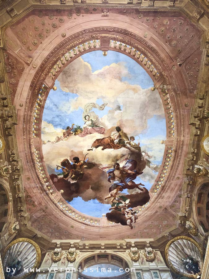 The frescoed ceiling of the central hall of the villa