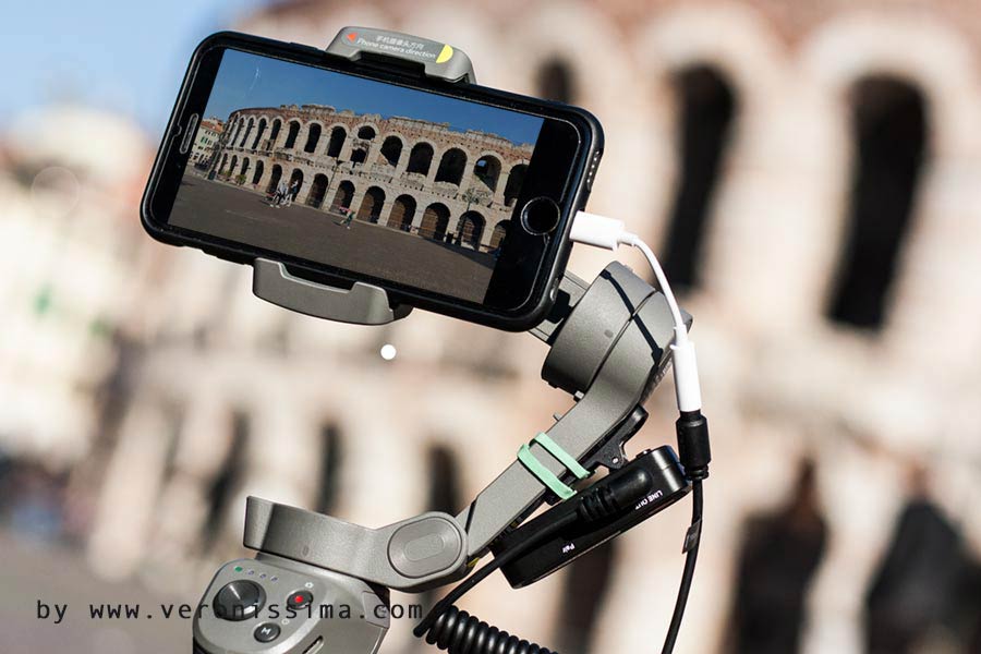 Arena Roman amphitheater through the screen of a smartphone mounted on a gimbal